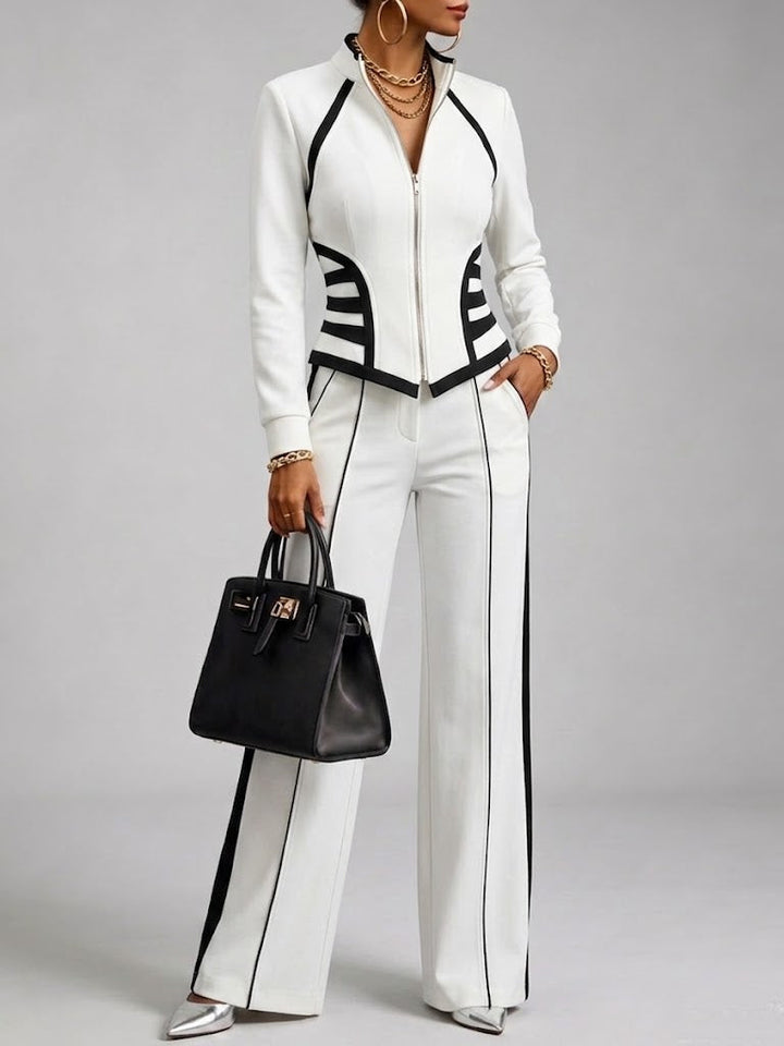 Ensemble Deux-Pièces Confortable et Décontracté Comprenant Un Sweat-Zippé Ajusté et Élastique et Un Pantalon Avec Finition En Sangle Noire.