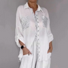 Ensemble composé d'une blouse et d'un pantalon avec des paillettes